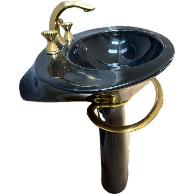 This is a very rare, gorgeous black pedestal sink with gold highlights by Kohler from 1986. It's in very good condition...