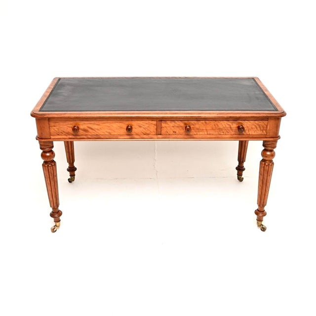 A fantastic antique Victorian satin wood writing table / desk by Maple and Co. This was made in England, it dates from...