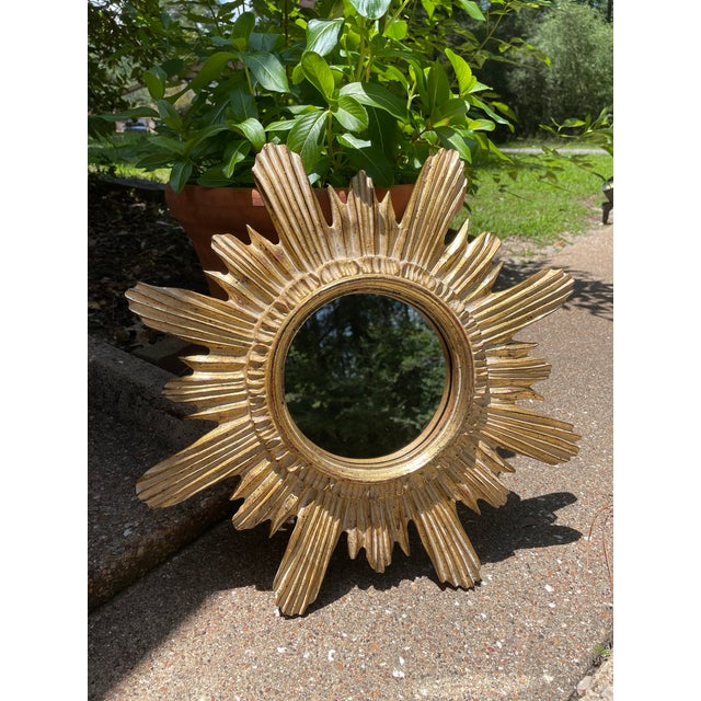 A stunning 16" Italian style Gilded Sunburst Wall Mirror from the 1970s. This Mid Century Modern composite wood mirror...
