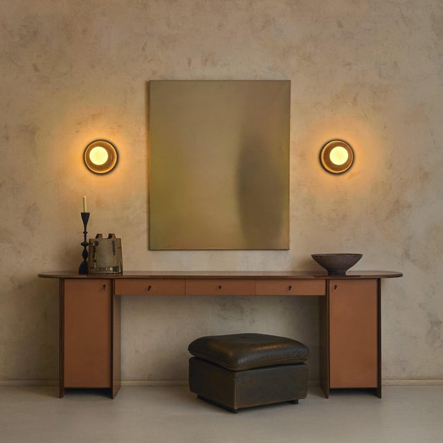 This rare Italian wood and leather console comes from the inaugural Artona series, designed in 1975 by Afra Bianchin...