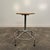 Mid Century Modern Workshop Stool. This stool features a round wooden seat that swivels and adjusts in height. The base is...