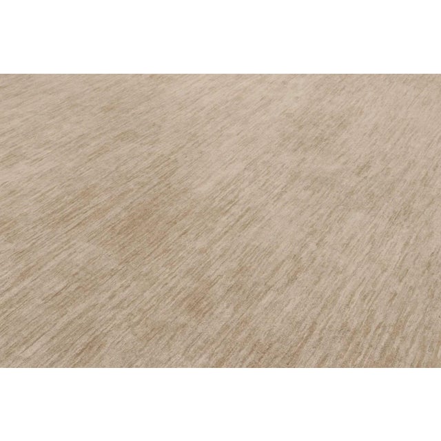 This oversized 14x24 contemporary textural rug is a sophisticated new addition to Rug & Kilim’s Textural collection—an...