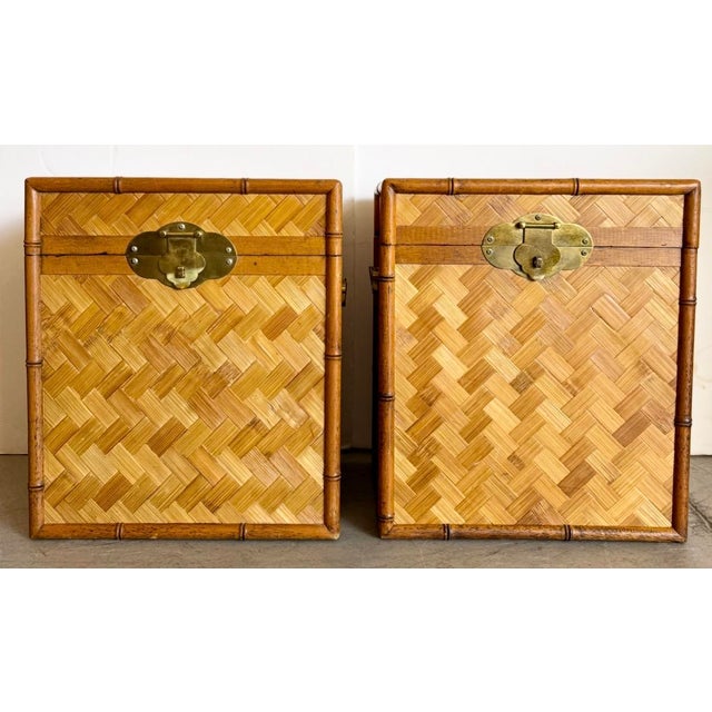 Set of two Asian bamboo and woven rattan storage trunks, often used as side tables, nightstands, or decorative floor...