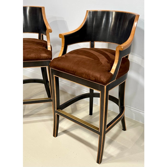 A refined pair of custom bar stools by Gregorius | Pineo (unsigned) showcasing the brand’s signature balance of classical...