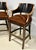 A refined pair of custom bar stools by Gregorius | Pineo (unsigned) showcasing the brand’s signature balance of classical...