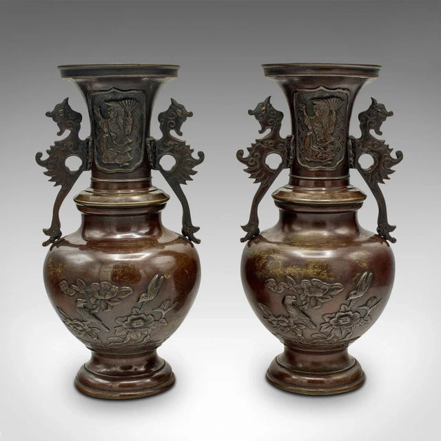 This is a pair of antique decorative urns. A Japanese, bronze baluster vase, dating to the Victorian period, circa 1850....