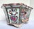 Chinese hexagonal porcelain planter. Each side has colorful Chinese figural scenes. The scalloped crown is also decorated...