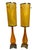 Exceptional pair of vintage sculptural table lamps featuring elongated amber/orange glass bodies with beautiful...