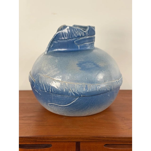 This is a large, blue, abstract ceramic vase with a unique designed, estimated to be from the late 20th century. It is...