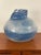 This is a large, blue, abstract ceramic vase with a unique designed, estimated to be from the late 20th century. It is...