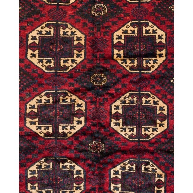 This lovely antique Caucasian Kazak carpet measures 4.8 x 9.5 ft and is from the 1940s.