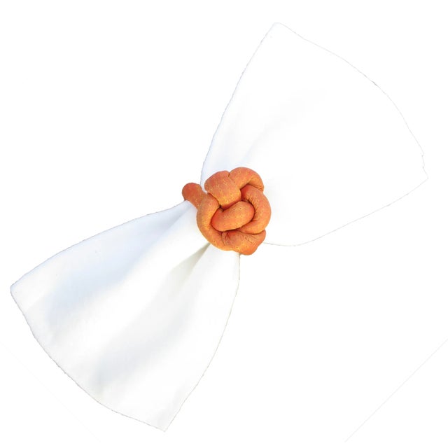 Colorful set of 6 fabric knot napkin rings in a shimmery melon / orange hue. Sure to brighten any place setting. Two other...
