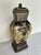 Elegant, decorative tall lidded vessel or urn. Black and gold renaissance revival artistry featuring cherubini, coat of...
