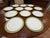 Design Plus Gallery presents a Set of Twelve English Pottery Plates, Stamped by Mintons. The plates have three rings of...