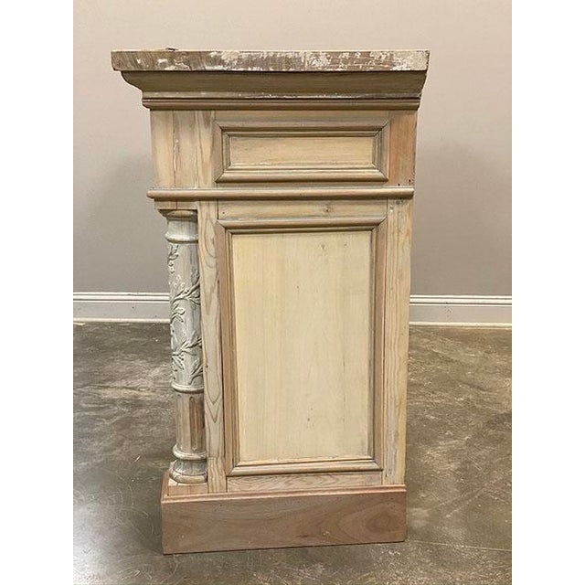 French Louis XVI Neoclassical Style carved wood fireplace mantel featuring intricately carved fluted columns with leaf...