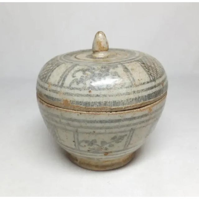 A pair of ceramic boxes from the Sukhothai and Ayutthaya periods in Thailand. The blue box coming from the earlier...