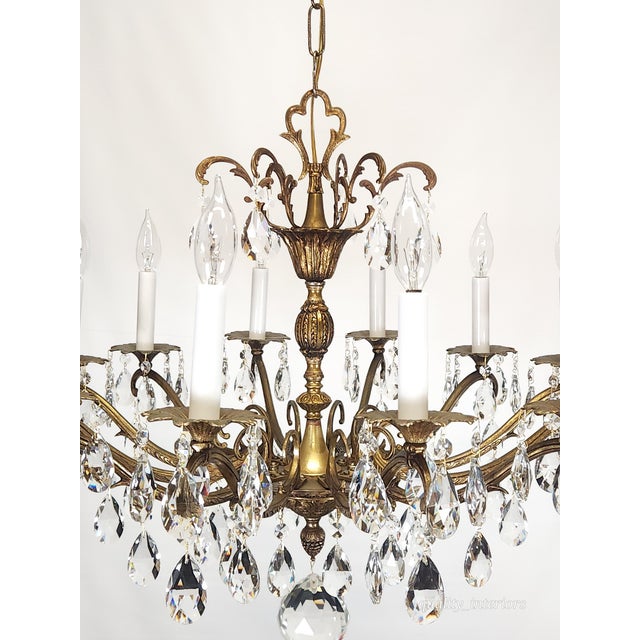 Offered for your consideration is an Antique 12 Light Captivating Curvaceous Brass Cut Lead Crystal Chandelier . The...