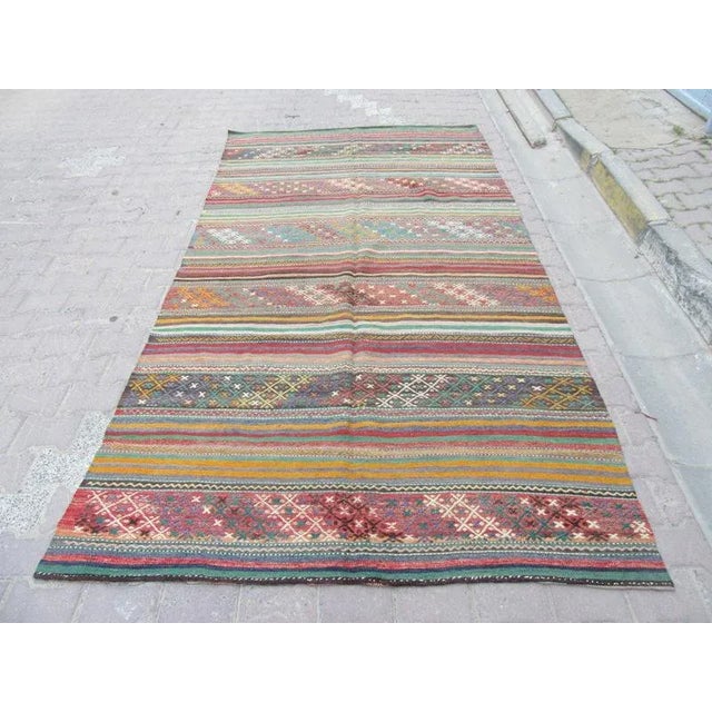 Handwoven Vintage Kilim rug from Denizli region of Turkey. Approximately 45-55 years old.In very good condition.