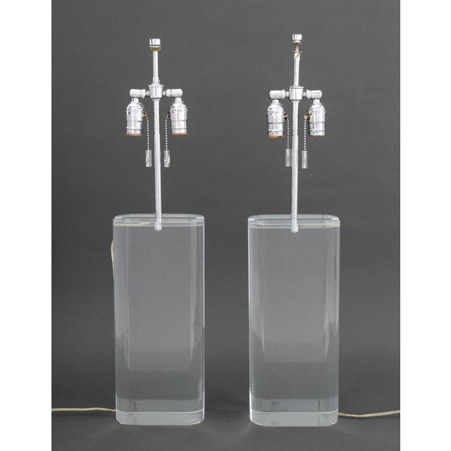 Pair of Modern Clear Acrylic and Chrome Table Lamps. Taller: 28.75" H x 6.75" W x 4" D. Provenance: From a 500 Park Avenue...