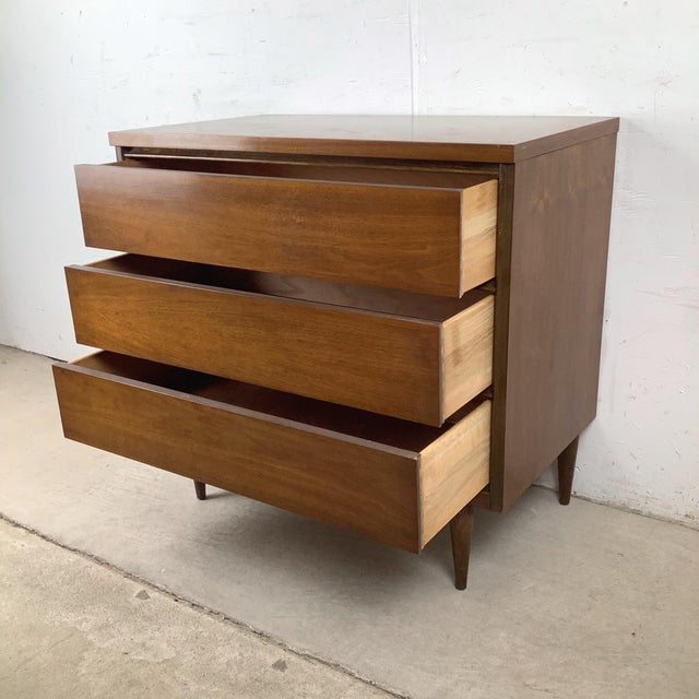 A quintessential piece of American mid-century modernism, this three-drawer chest by Bassett Furniture exemplifies the...