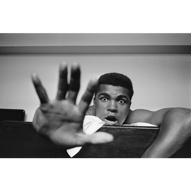 Give Me Five 27th May 1963: American Heavyweight boxer Cassius Clay (later Muhammad Ali) lying on his hotel bed in London....