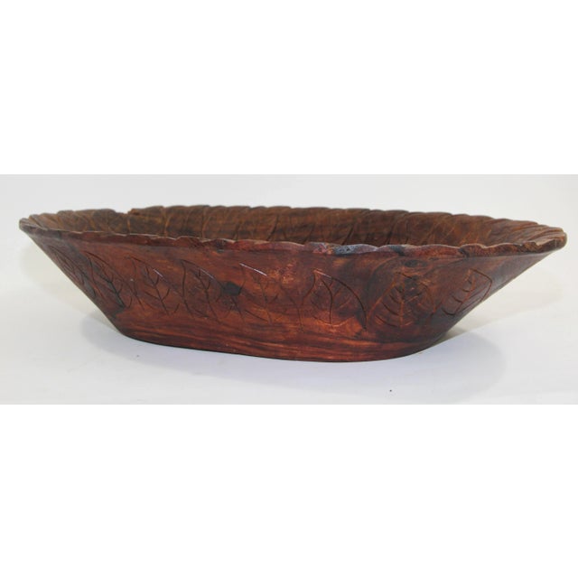 Large beautiful and sustainable hand carved wooden bowl with gorgeous leaf design from the Batak of Sumatra, mid-20th...