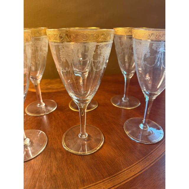 The Antique Cambridge Etch 701 7" Water Goblets are a set of 8 elegant and vintage water glasses featuring intricate...