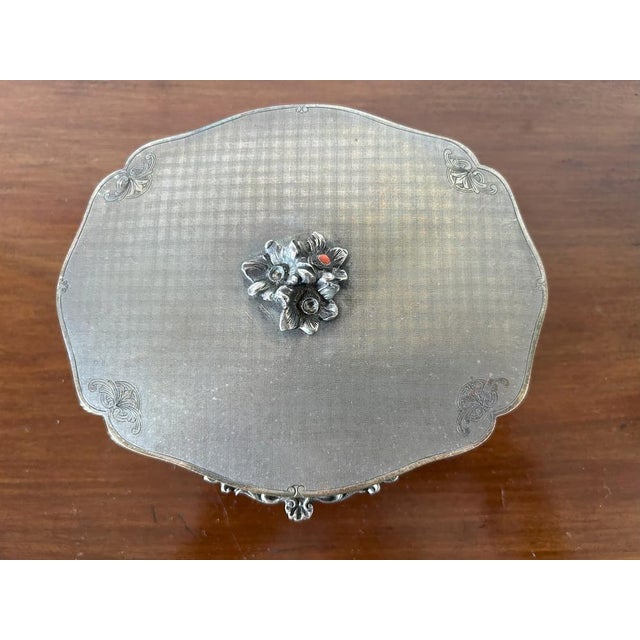 Art Nouveau silver casket, Italy, early 20th century The casket is decorated with a satin base with thin interlacing and...