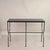 Chic 'Arcade' Iron and Black Limestone Console by Design Frères. Its slender Art Deco-inspired geometric silhouette is...