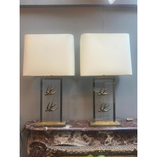 A large pair of French ' Hollywood Regency" table lamps with cream shades which are original to the lamps. The skyscraper...