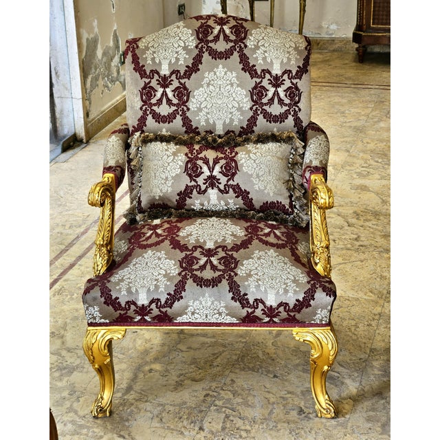 Bring classic European elegance to your interior with this ornate French-style armchair, featuring richly patterned...