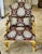 Bring classic European elegance to your interior with this ornate French-style armchair, featuring richly patterned...