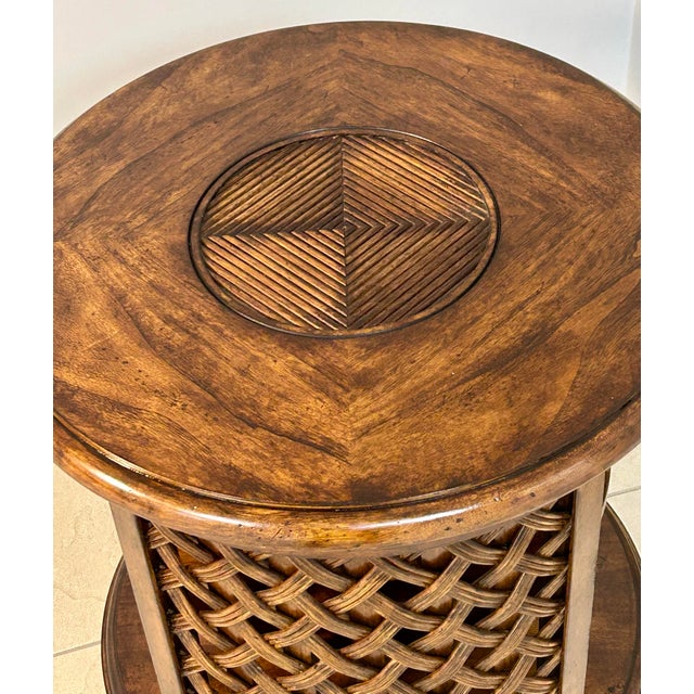 British colonial style all wood end table/side table. Quartered cherry veneer, braided rattan panels, two spacious lower...