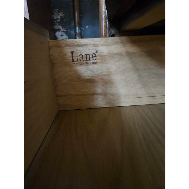 Mid-century modern tallboy dresser from the "Staccato" collection by Lane Furniture. Crafted from walnut and walnut...