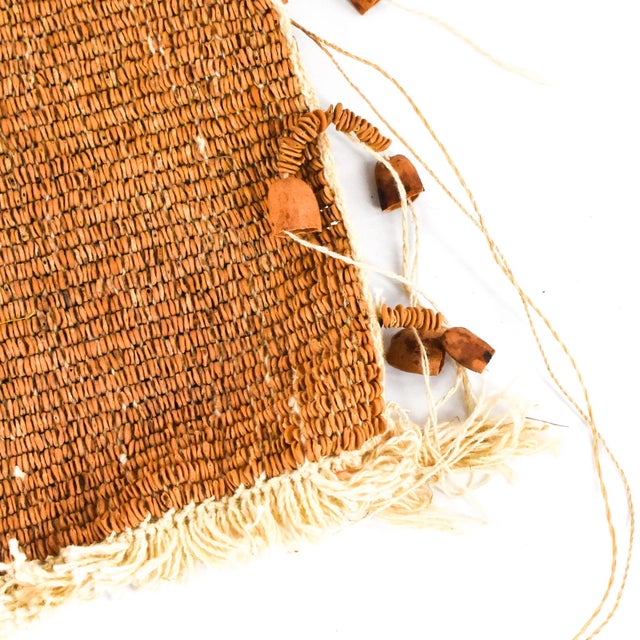 The Mossi woven apron from Burkina Faso is a testament to the rich cultural heritage and skilled craftsmanship of the...