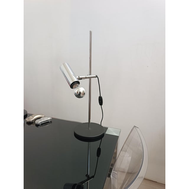Beautiful table lamp by Staff Leuchten. Germany, 1970s. Matte black lacquered metal base. The arm supporting the reflector...