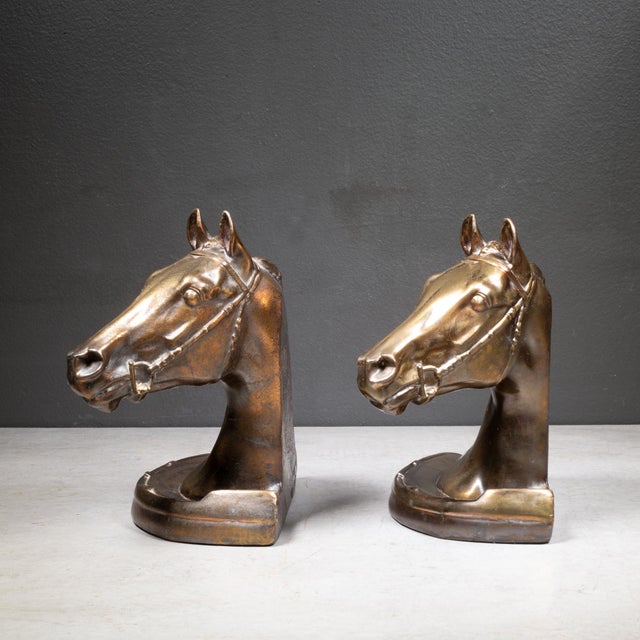 ABOUT An original pair of bronze plated horse head bookends designed by Gladys E. Brown and manufactured by Dodge Trophy...