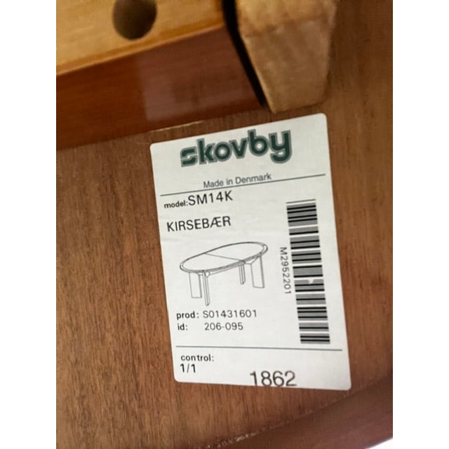 Skovby teak Danish Modern dining set includes an oval extendable table and four chairs. The table has a warm wood finish...