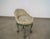Vintage vanity stool for sale. It's a very unique stool with a top that swivels. It has the original striped fabric that...