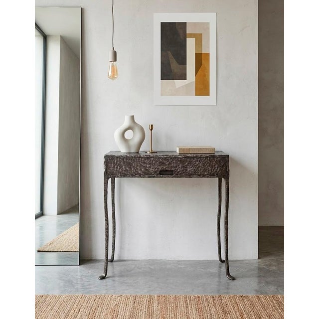 Unique modern accent table entirely hand-forged from solid steel with a deep multi-layered patinated finish. This is not...