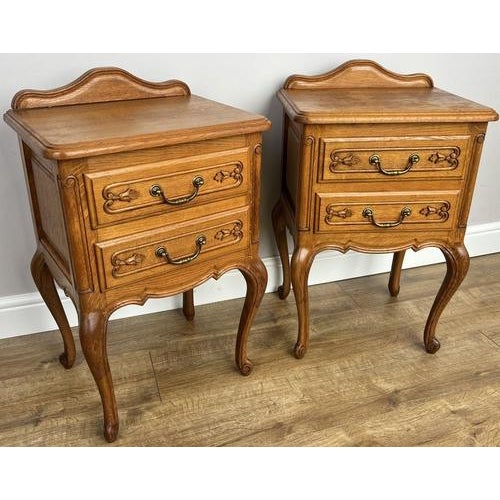 This elegant pair of Vintage French Louis bedside tables features graceful proportions and charming carved detailing...