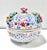 A decorative pierced porcelain lidded jar adorned with vibrant hand-applied roses and colorful floral motifs. The domed...