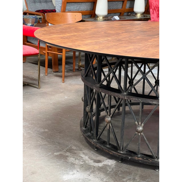 Oversized custom table that will steal the show. Reclaimed lattice circular iron base with a custom made 80" walnut top....