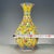A beautiful Chinese yellow ground porcelain vase. This hexagonal vase features a pear shape and is finely hand-painted...