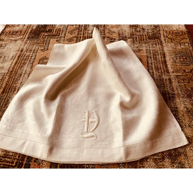 A rare find for the discerning collector—this luxurious French linen torchon represents the pinnacle of Belle Époque...