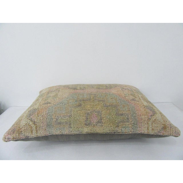 Decorative pillow cover made from a vintage Turkish handknotted rug. Backed with good quality cotton fabric. Pillow...