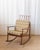 Clean-lined and quietly sculptural, this Edmond Spence–style rocking chair embodies the warmth and restraint of mid-...