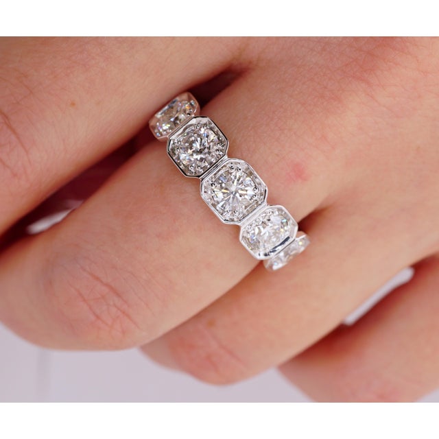 Natural Diamond Eternity Band set in 14K White gold. 11 Large Round Brilliant diamonds and small pave diamonds are F-G...