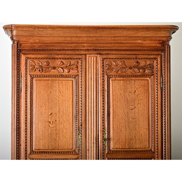 A stunning French oak buffet à deux corps (cabinet in two sections) from the 18th century, designed with features and...