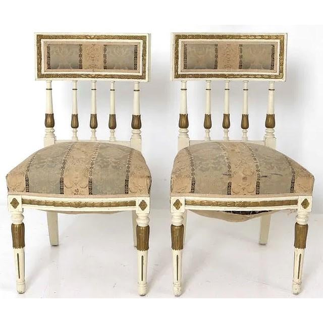 An intersted set of 4 vintage Swedish Gustavian dining chairs. The chairs have a great look and are finished in a cream...